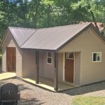 Small backyard shed with porch in wooded area