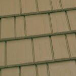 Close-up of beige roof shingles pattern.