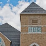 Church with stained glass and brick exterior.