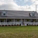 Suburban house with large porch and decorations.