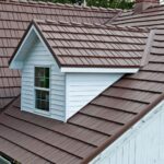 Brown metal roof with dormer and chimney.