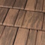 Close-up of brown wooden roof shingles.